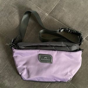 Doughnut brand new sling bag/Fanny pack color purple with multiple pockets